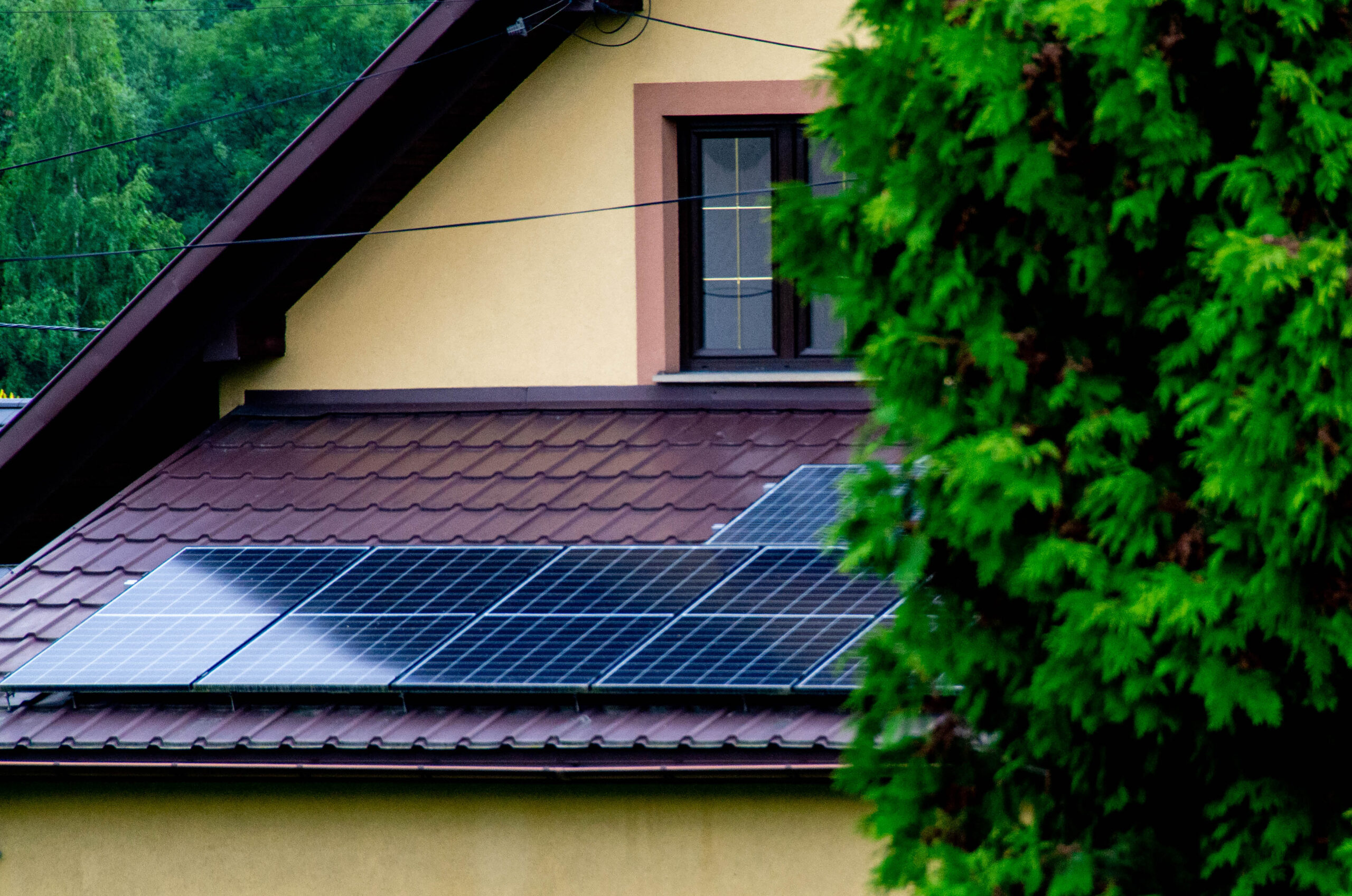 Historic farm house with modern solar panels on roof and wall Illustration